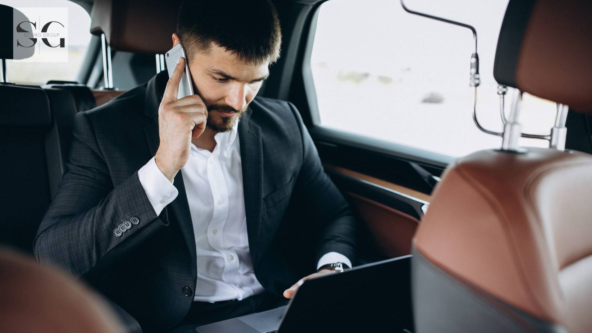 an executive travelling in a car