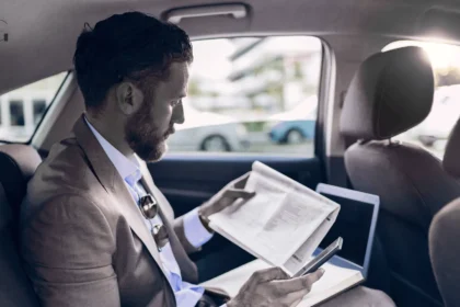 an executive traveling in a car