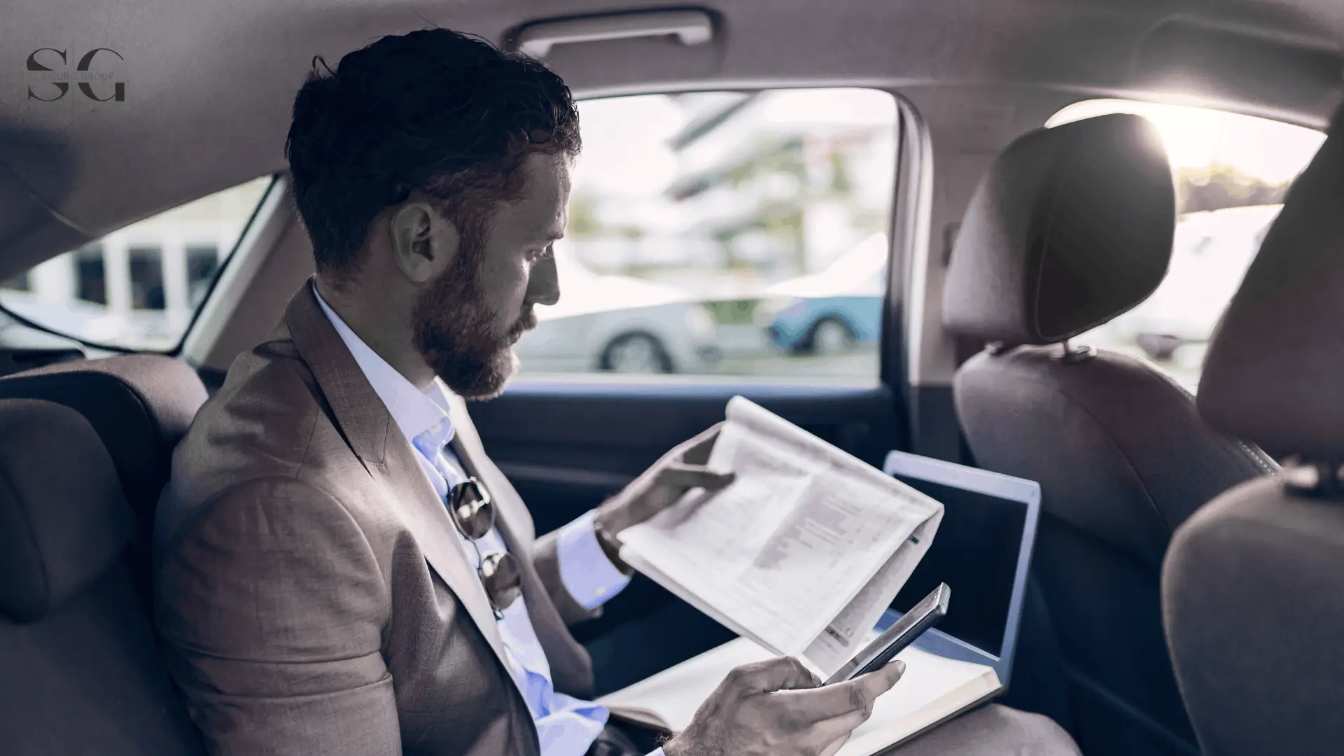 an executive traveling in a car